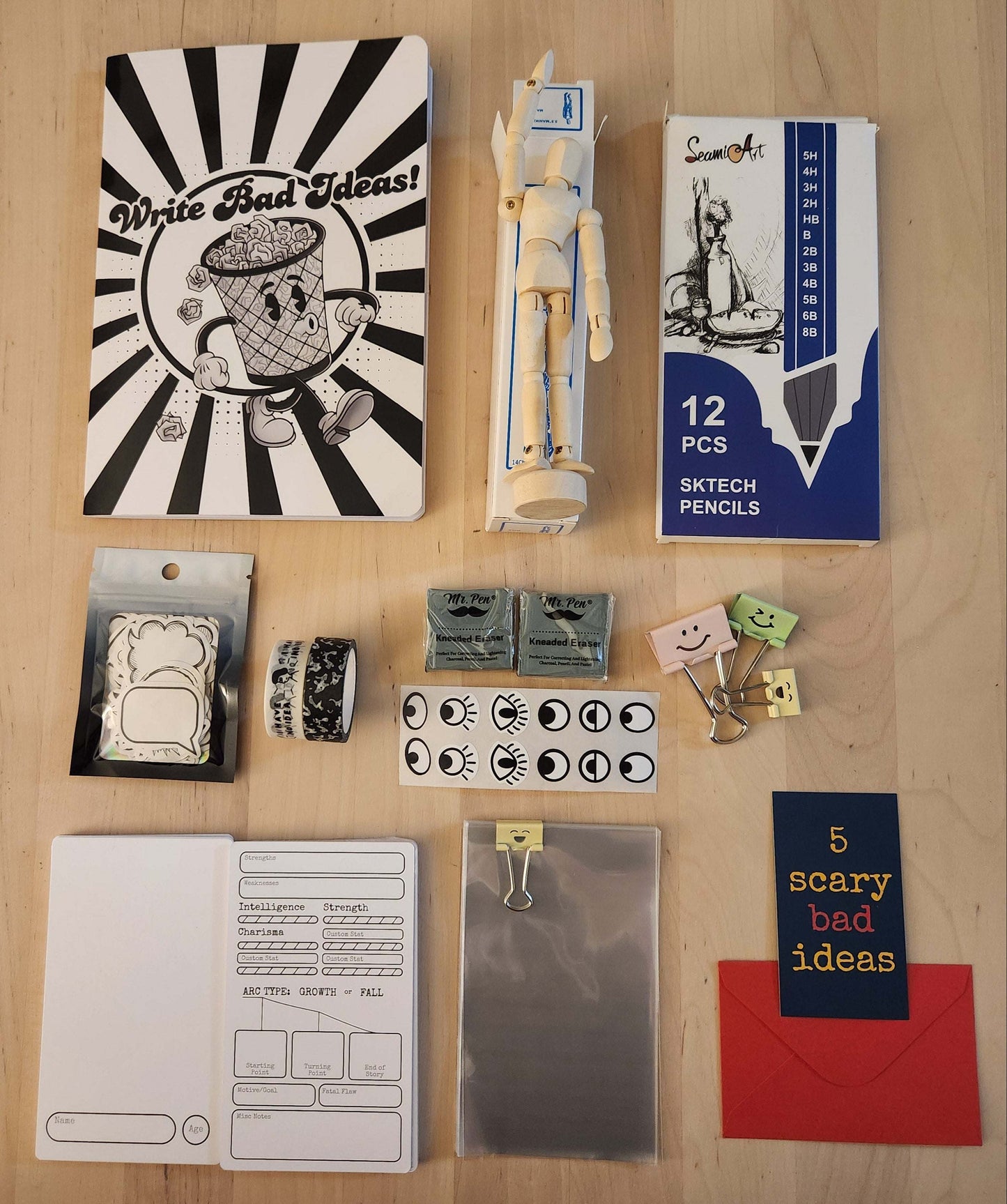 Collection of stationery items including pencils, stickers, and other supplies on a wooden surface.