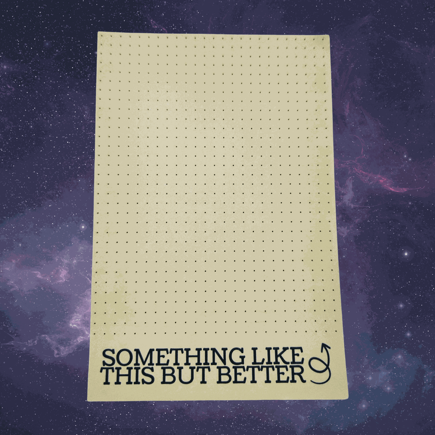 Sheet of grid paper with text 'Something Like This But Better' on a starry space background