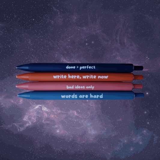 Four pens with motivational phrases on a starry space background